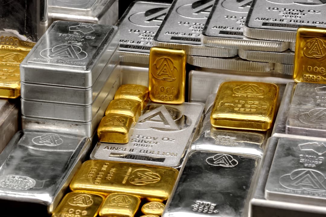 Close up of gold and silver bullion bars from Ainslie Bullion