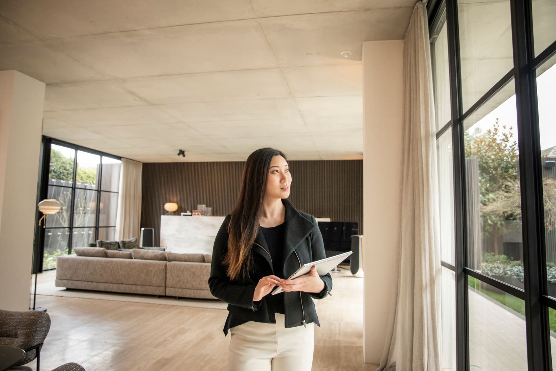 Woman performing property valuation walking towards camera