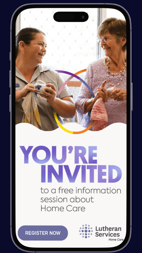 Two woman drying dishes in a kitchen
