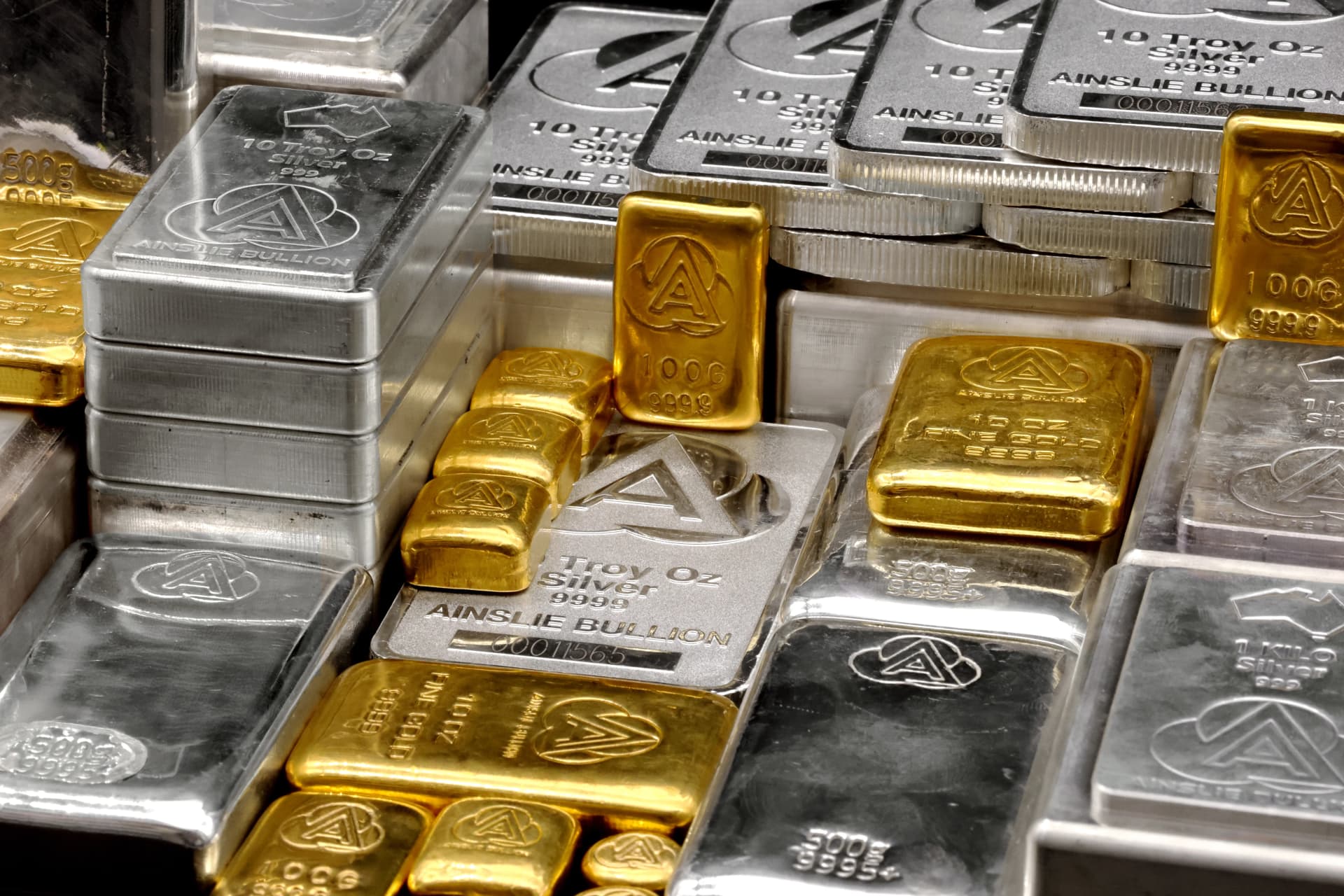 Close up of gold and silver bullion bars from Ainslie Bullion