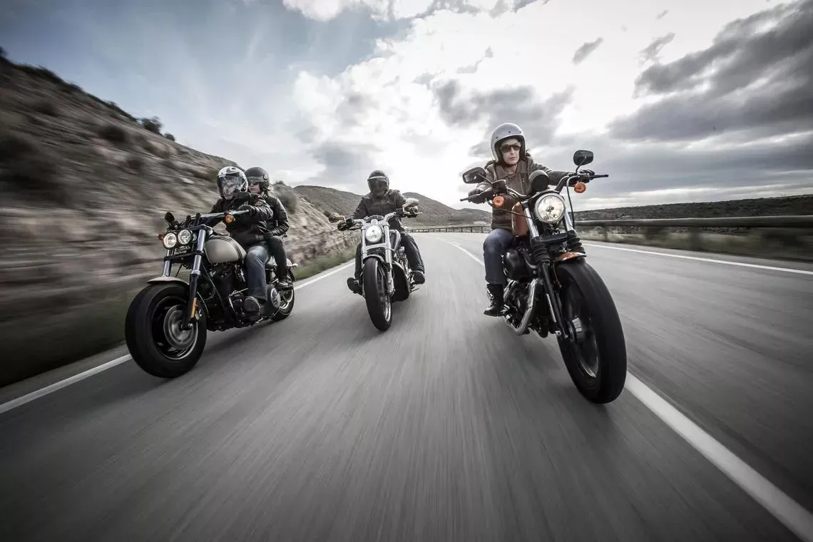 Three Harley-Davidson riding towards the camera front on